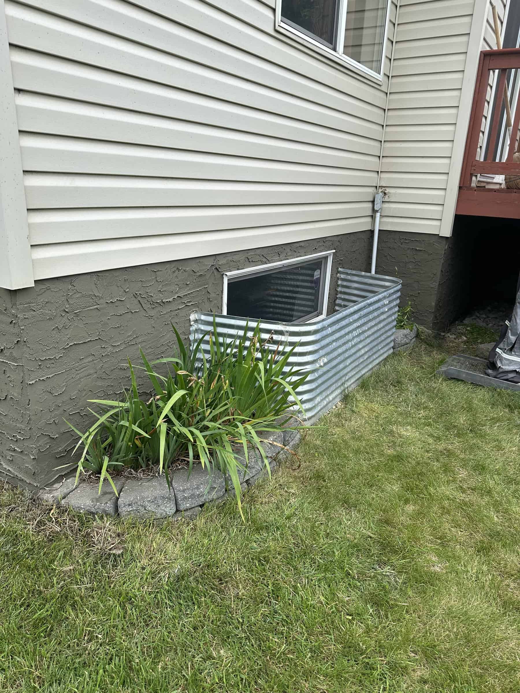 Finished foundation parging on a Spruce Grove home by J and J Coatings